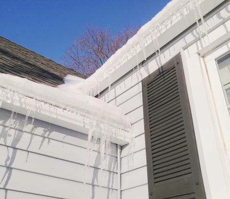  Ice dam on a Cleveland roof causing attic leaks and mold
